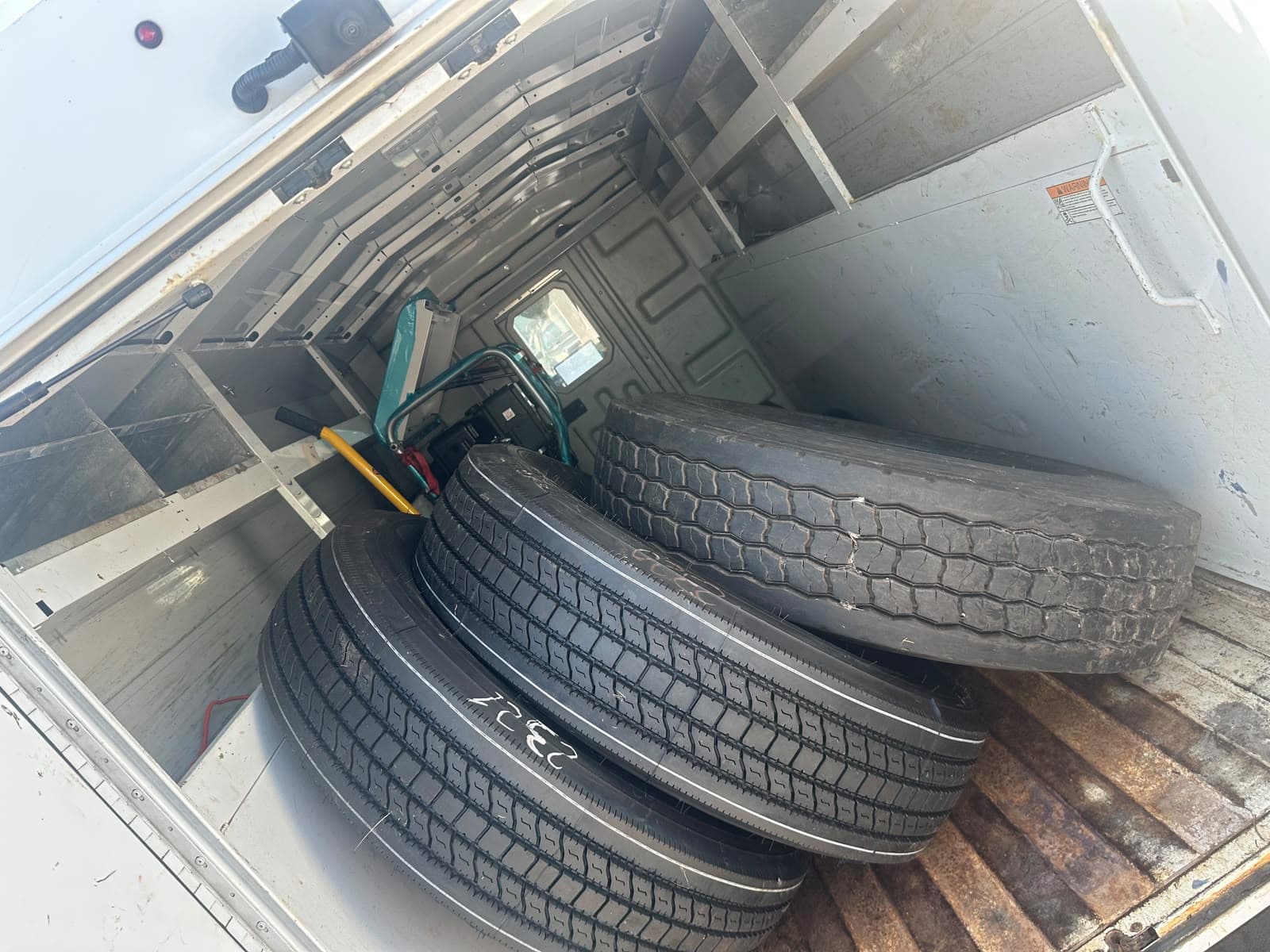 Commercial truck tires loaded in the Punjab Truck Care and Roadside service van